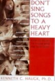 Don't Sing Songs to a Heavy Heart How to Relate to Those Who Are Suffering  9781930445123 Front Cover